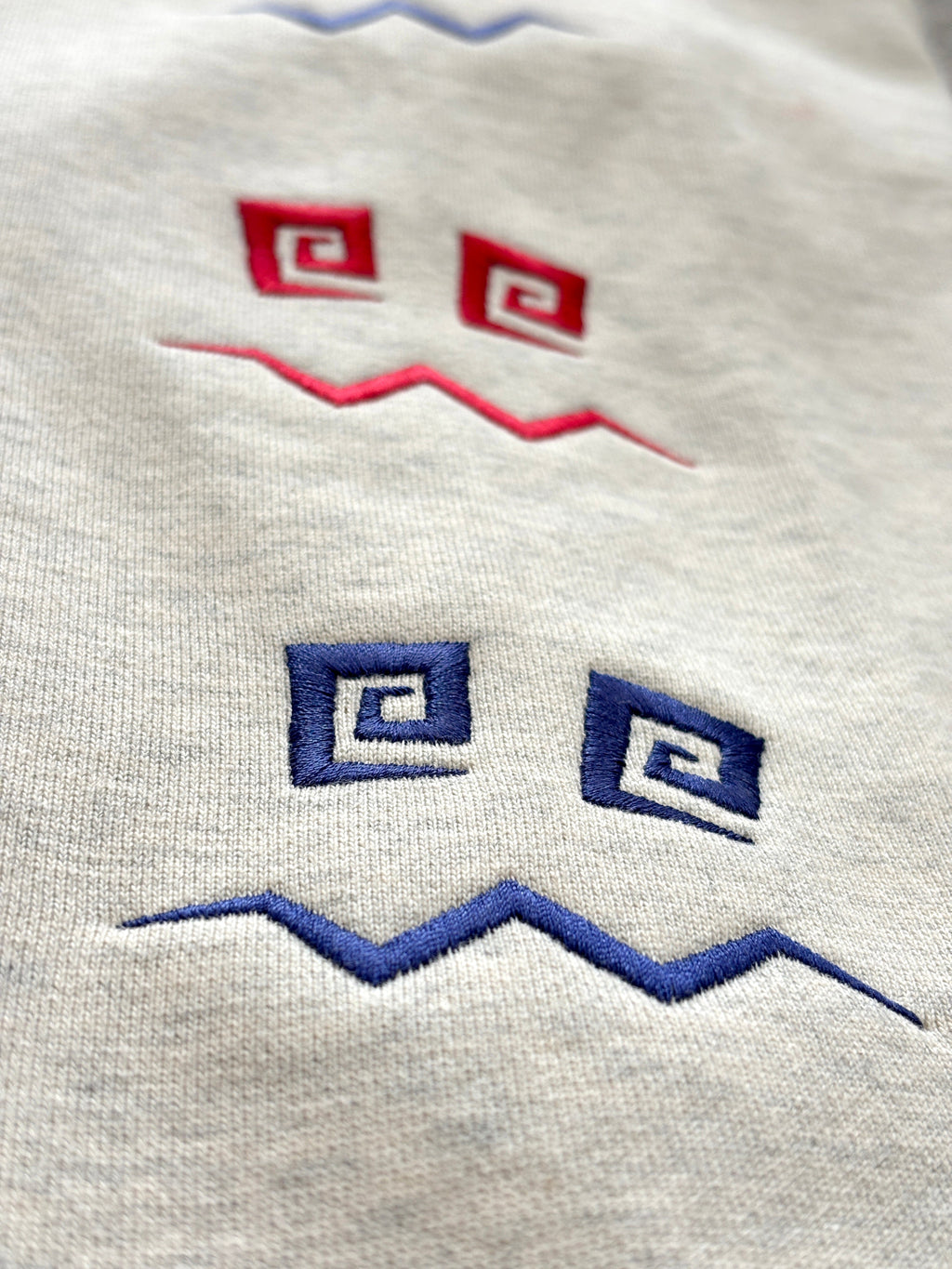 Emroided Repeating Face Sleeve Snap Hoodie PODpartner